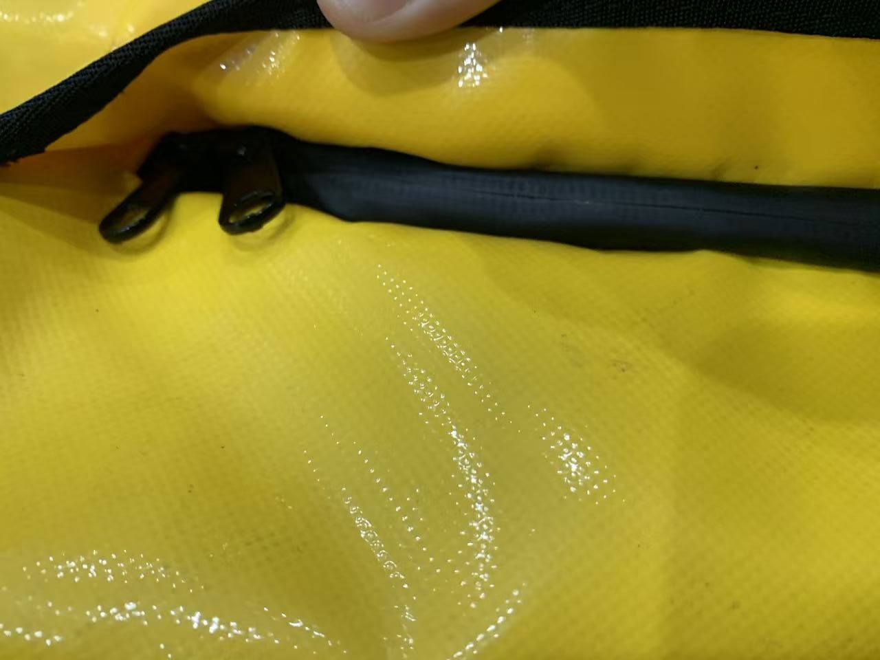 Close-up of RF-welded anchor points and non-reflective stealth hardware on an OEM tactical dry bag2.